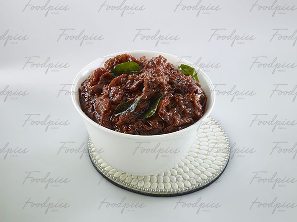 Tomato Pickle Tomato pickle with tempered curry leaves stock photo