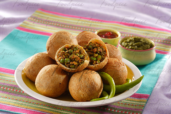 Green Peas Kachori Spicy deep fried quiche with green peas inside stock photo