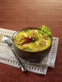 Punjabi Kadhi Hot lentil & yogurt curry garnished with red chilies image preview