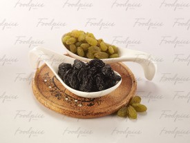Raisin Black & golden raisins in ceramic spoons preview