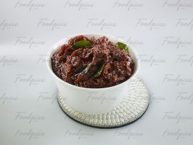 Tomato Pickle Tomato pickle with tempered curry leaves image preview