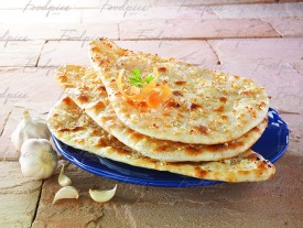 Butter Garlic Naan Flat bread galzed with caramalised garlic & butter image preview