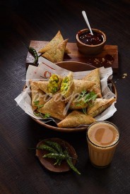 Samosa Stuffed Savoury pasties with Indian tea image preview