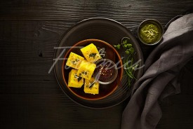 Dhokla Top angle shot of steamed lentil cakes image preview
