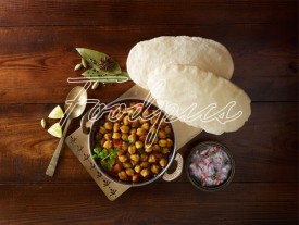 Chole Bhature Chickpeas curry & flat bread in top angle image preview