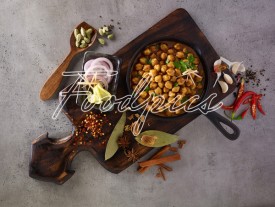 Chana Masala Chick pea curry in rustic pan top angle image preview