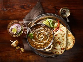 Dal Makhani Spicy black lentil curry with flat breads image preview