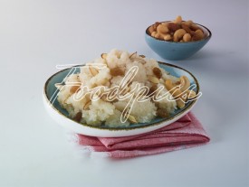 Sheera Sweet semolina pudding with bowl of dry fruits image preview